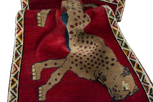 Corner detail of 2000s Persian Gabbeh rug showing border pattern and Wool pile