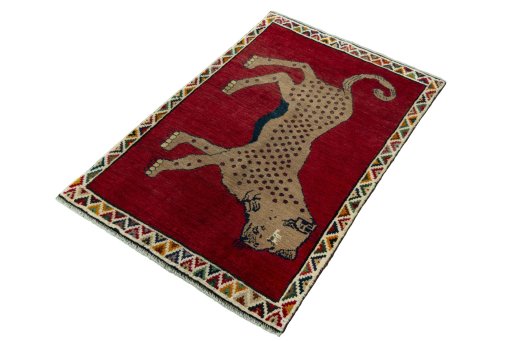 Corner detail of 2000s Persian Gabbeh rug showing border pattern and Wool pile