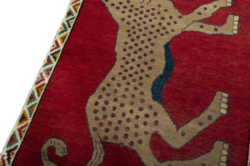 Backside of handmade 2000s Persian Gabbeh rug showing knot structure and weave density