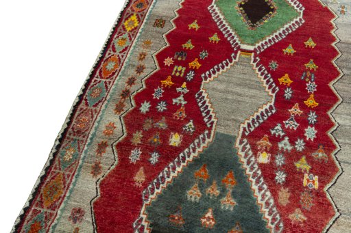 Backside of handmade 2000s Persian Gabbeh rug showing knot structure and weave density