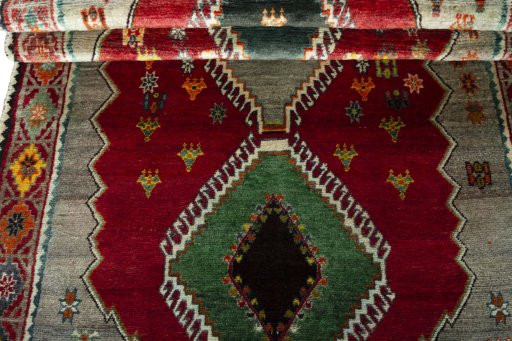 Full view of 2000s Persian Gabbeh rug from Iran / Persia, 225 × 123 cm in Red tones