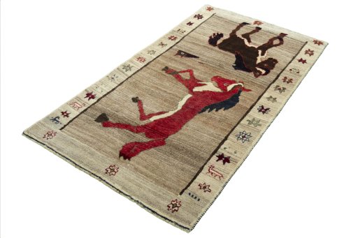 Corner detail of 2000s Persian Gabbeh rug showing border pattern and Wool pile