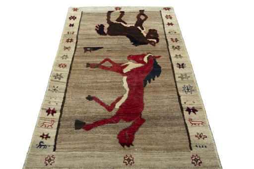 Surface texture of 2000s Persian Gabbeh rug with natural Wool and intricate pattern