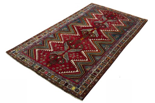 Corner detail of 2000s Persian Gabbeh rug showing border pattern and Wool pile