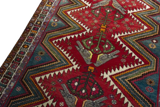 Backside of handmade 2000s Persian Gabbeh rug showing knot structure and weave density