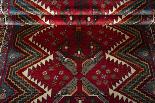 Full view of 2000s Persian Gabbeh rug from Iran / Persia, 252 × 149 cm in Red tones