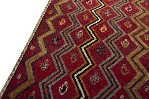 Backside of handmade 2000s Persian Gabbeh rug showing knot structure and weave density