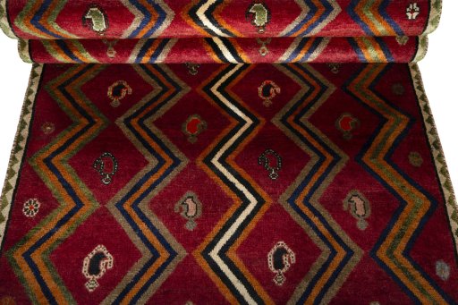 Full view of 2000s Persian Gabbeh rug from Iran / Persia, 234 × 111 cm in Red tones