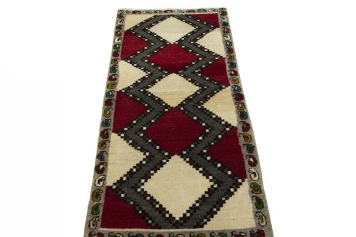 Surface texture of 2000s Persian Gabbeh rug with natural Wool and intricate pattern