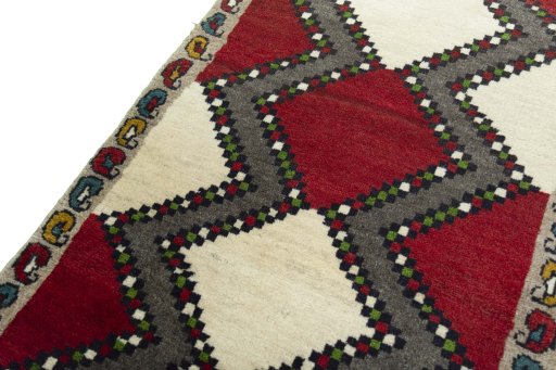 Backside of handmade 2000s Persian Gabbeh rug showing knot structure and weave density