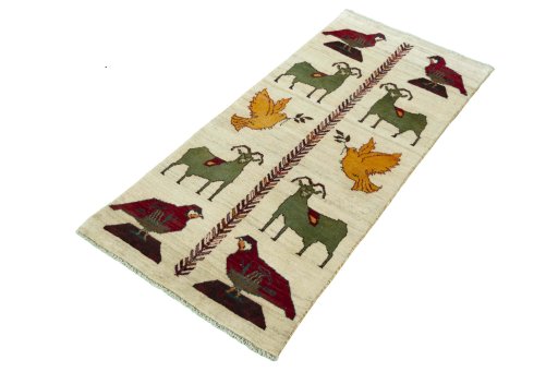 Corner detail of 2000s Persian Gabbeh rug showing border pattern and Wool pile