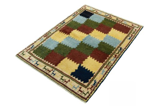 Corner detail of 2000s Persian Gabbeh rug showing border pattern and Wool pile
