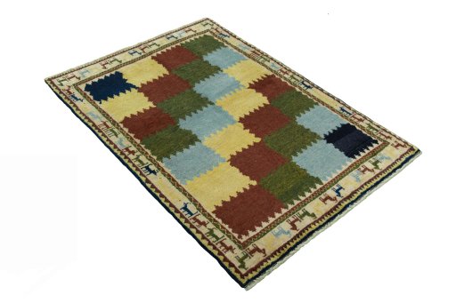 Close-up detail of 2000s Persian Gabbeh rug from Iran / Persia showing Wool weave