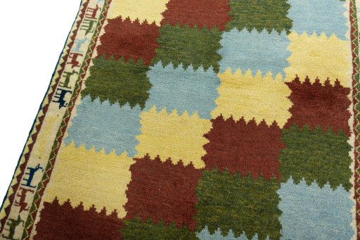 Backside of handmade 2000s Persian Gabbeh rug showing knot structure and weave density