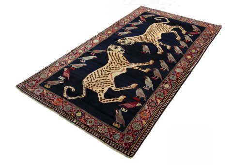 Corner detail of 2000s Persian Gabbeh rug showing border pattern and Wool pile