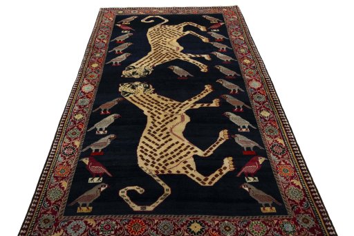 Surface texture of 2000s Persian Gabbeh rug with natural Wool and intricate pattern