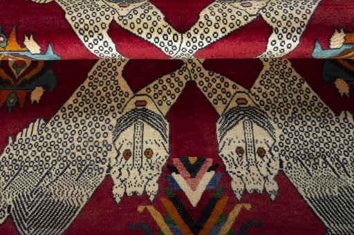 Corner detail of 2000s Persian Gabbeh rug showing border pattern and Wool pile