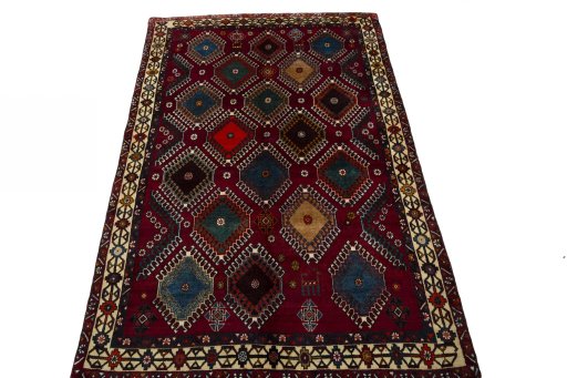 Surface texture of 2000s Persian Gabbeh rug with natural Wool and intricate pattern