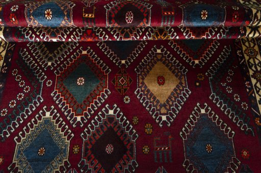 Full view of 2000s Persian Gabbeh rug from Iran / Persia, 235 × 146 cm in Red tones
