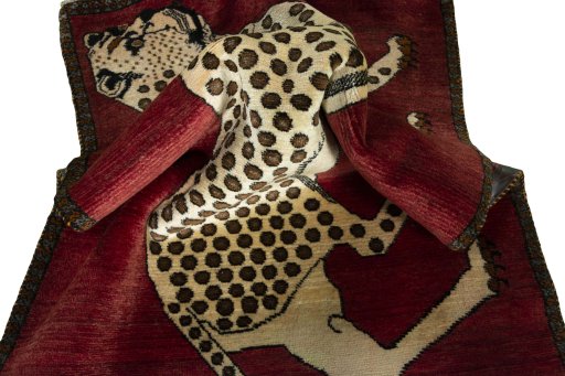 Corner detail of 2000s Persian Gabbeh rug showing border pattern and Wool pile