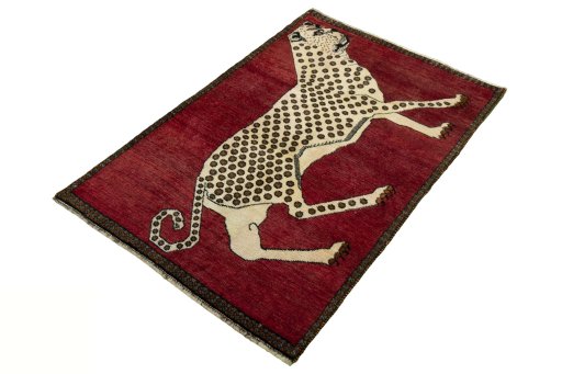 Corner detail of 2000s Persian Gabbeh rug showing border pattern and Wool pile