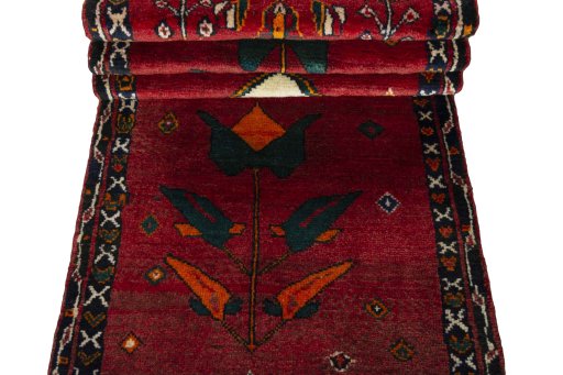 Corner detail of 2000s Persian Gabbeh rug showing border pattern and Wool pile