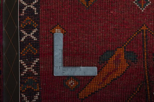 Surface texture of 2000s Persian Gabbeh rug with natural Wool and intricate pattern