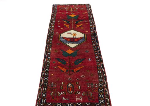 Surface texture of 2000s Persian Gabbeh rug with natural Wool and intricate pattern