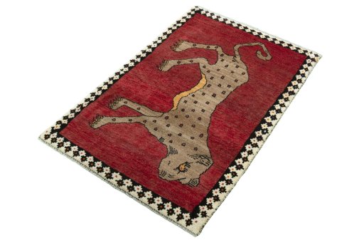 Corner detail of 2000s Persian Gabbeh rug showing border pattern and Wool pile