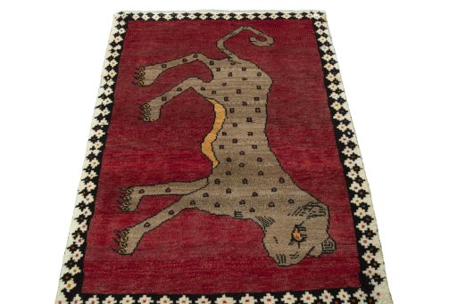 Surface texture of 2000s Persian Gabbeh rug with natural Wool and intricate pattern