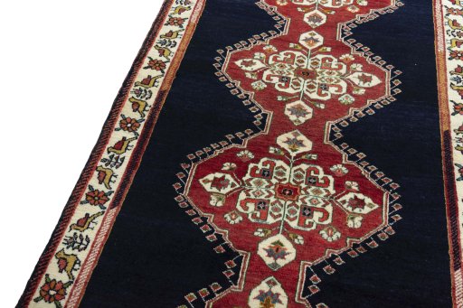 Backside of handmade 2000s Persian Gabbeh rug showing knot structure and weave density