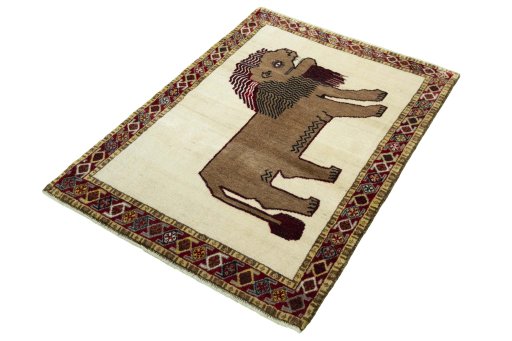 Corner detail of 2000s Persian Gabbeh rug showing border pattern and Wool pile