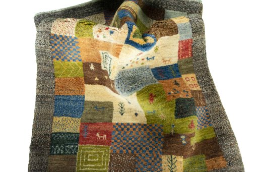 Corner detail of New Persian Gabbeh rug showing border pattern and Wool pile