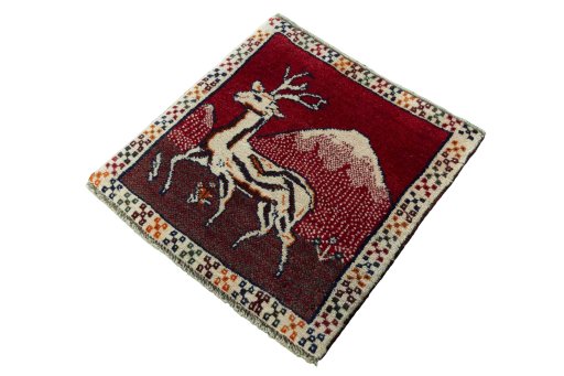 Corner detail of 2000s Persian Gabbeh rug showing border pattern and Wool pile