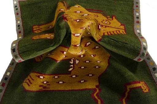 Corner detail of 2000s Persian Gabbeh rug showing border pattern and Wool pile