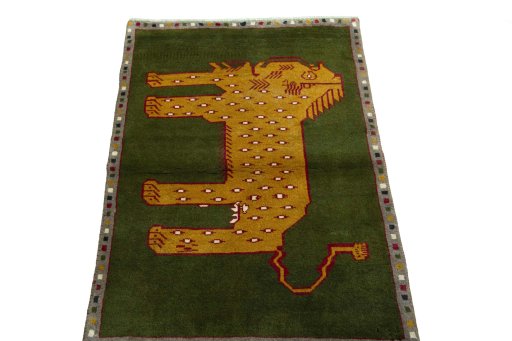 Surface texture of 2000s Persian Gabbeh rug with natural Wool and intricate pattern