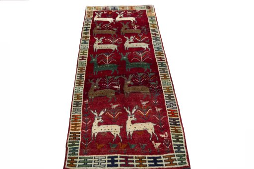 Surface texture of 2000s Persian Gabbeh rug with natural Wool and intricate pattern
