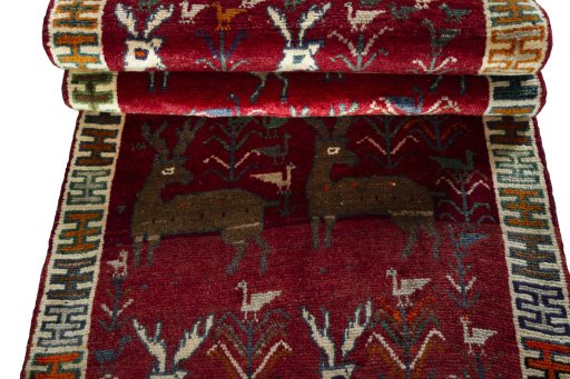 Full view of 2000s Persian Gabbeh rug from Iran / Persia, 245 × 95 cm in Red tones