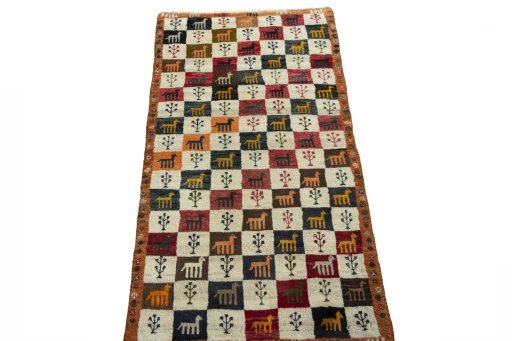 Surface texture of 2000s Persian Gabbeh rug with natural Wool and intricate pattern