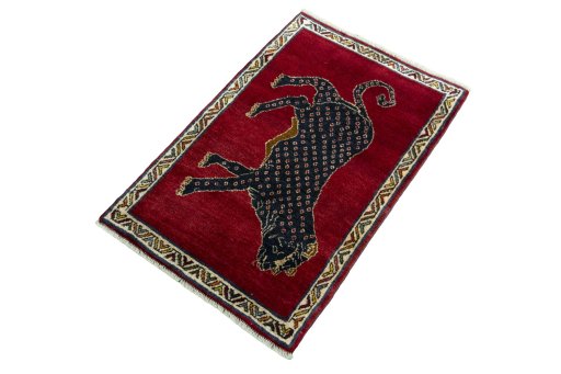 Corner detail of 2000s Persian Gabbeh rug showing border pattern and Wool pile