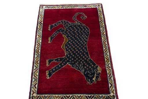 Surface texture of 2000s Persian Gabbeh rug with natural Wool and intricate pattern