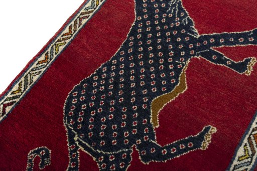 Backside of handmade 2000s Persian Gabbeh rug showing knot structure and weave density