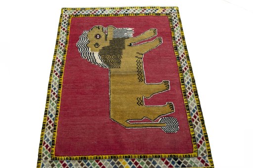 Surface texture of 2000s Persian Gabbeh rug with natural Wool and intricate pattern