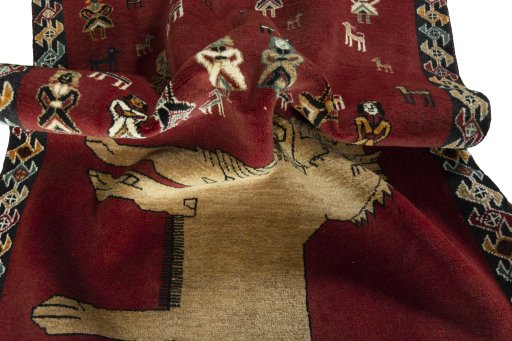 Corner detail of 2000s Persian Gabbeh rug showing border pattern and Wool pile