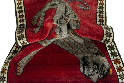Corner detail of 2000s Persian Gabbeh rug showing border pattern and Wool pile