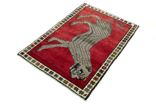Corner detail of 2000s Persian Gabbeh rug showing border pattern and Wool pile
