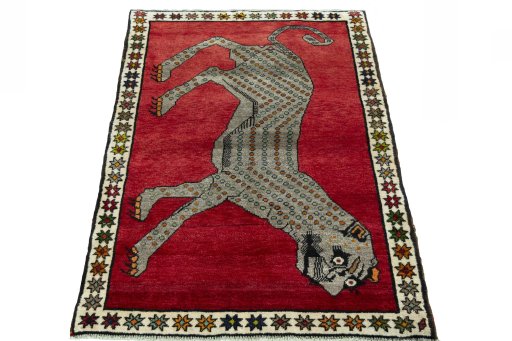 Surface texture of 2000s Persian Gabbeh rug with natural Wool and intricate pattern