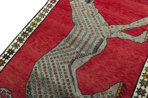 Backside of handmade 2000s Persian Gabbeh rug showing knot structure and weave density