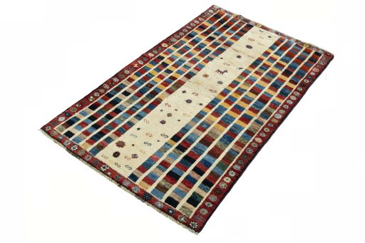 Corner detail of 2000s Persian Gabbeh rug showing border pattern and Wool pile