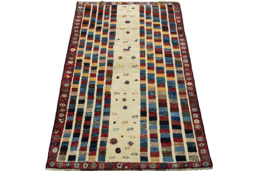 Surface texture of 2000s Persian Gabbeh rug with natural Wool and intricate pattern